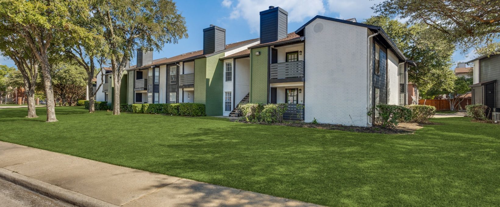 the green grass and trees at The Richmond