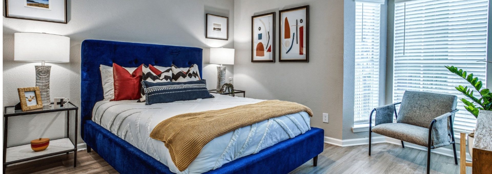 a bedroom with blue and red upholstered headboard at The Richmond