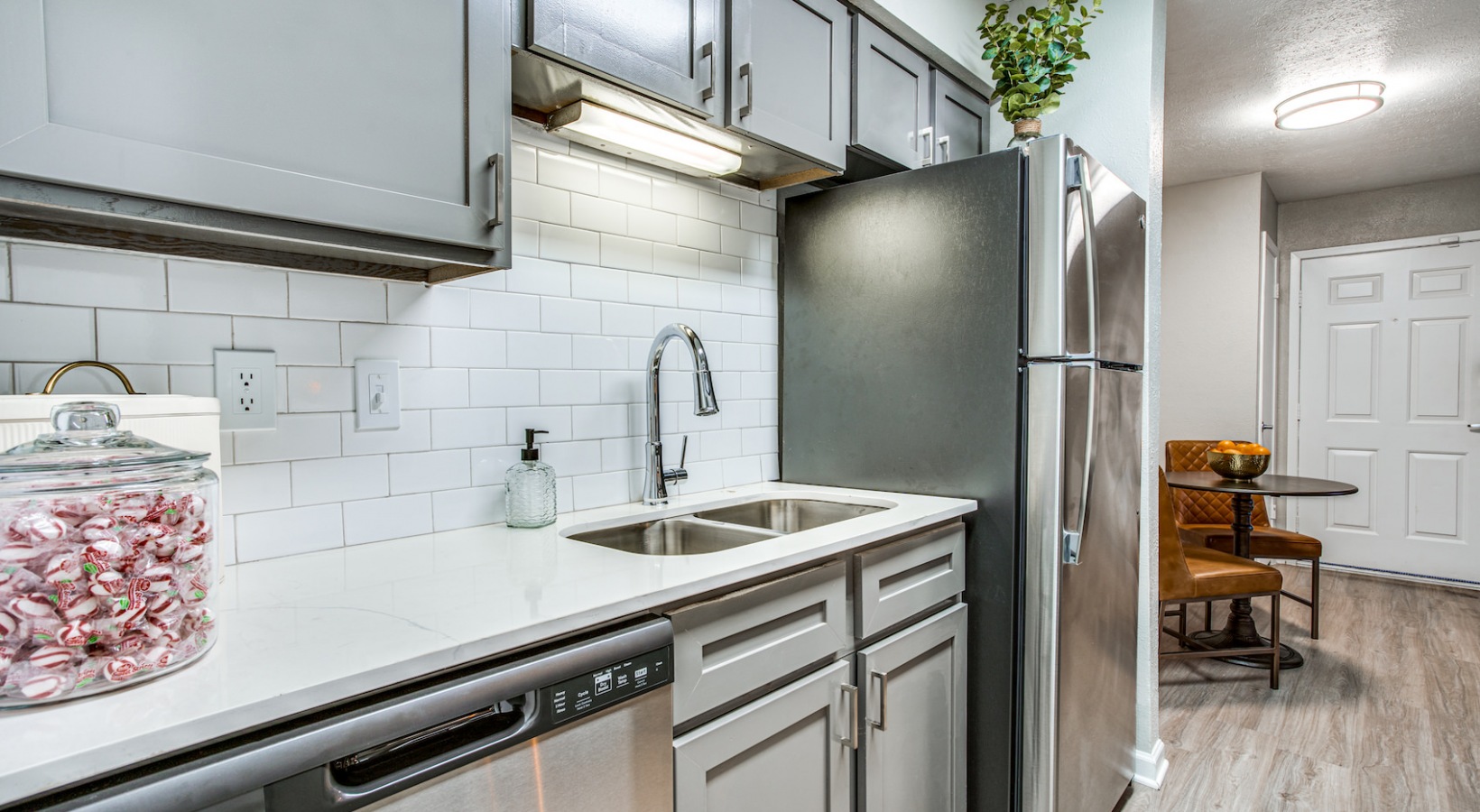 a kitchen with stainless steel appliances and a sink at The Richmond