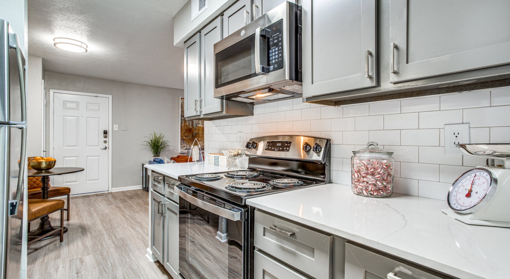 a kitchen with stainless steel appliances and a microwave at The Richmond